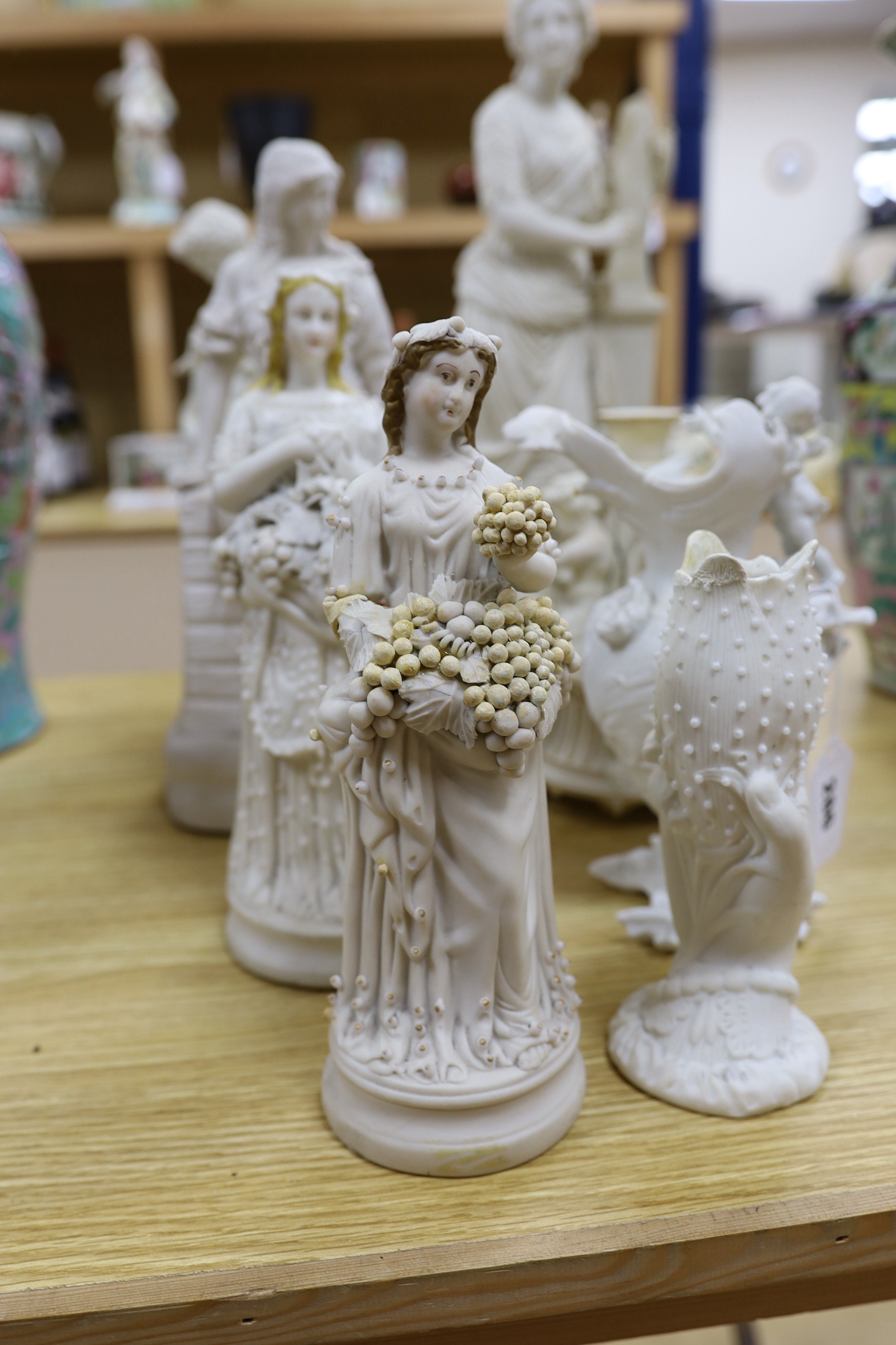 A group of Parian ware and bisque figures/ornaments. Some restoration (8) tallest 45cm